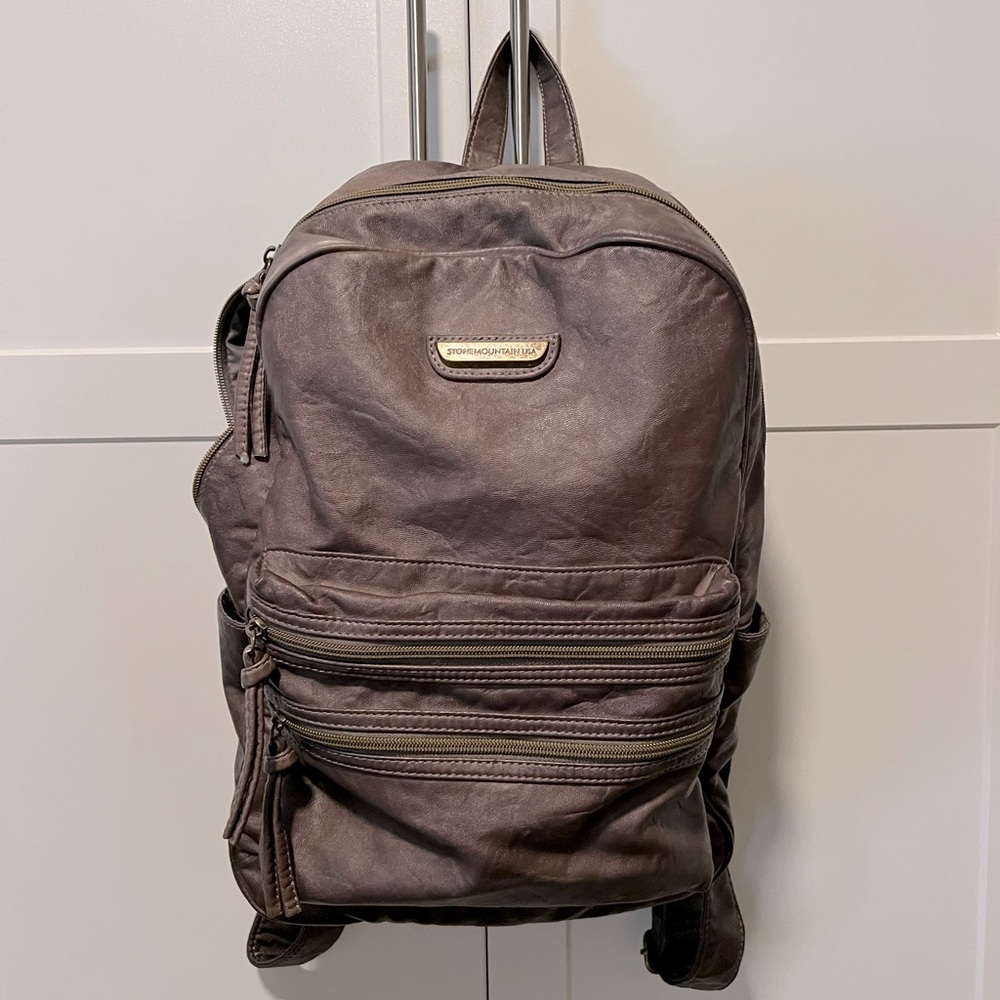 Light weight , soft leather backpack .